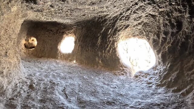 Interior man made caves window openings rock Jhong Chhoser cave Upper Mustang Nepal