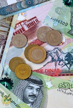 Bahraini dinar money banknotes and coins on table. Bahrain cash bills of BHD currency