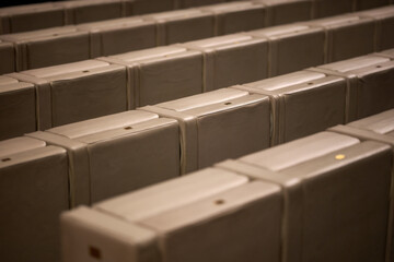 Rows of empty upholstered seats in a modern auditorium or conference hall, Gdansk, Pomerania, Poland, Europe © sebastiangora