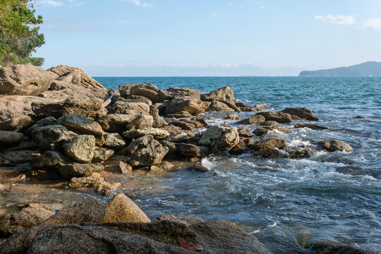 Rocky headlands and rocks are struck by powerful waves that crash with energy. Angra dos Reis &ndash; Rio de Janeiro, Brazil.