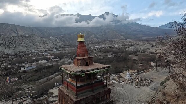 Elevated chorten overlooking entire Ghiling valley villages landscape Upper Mustang