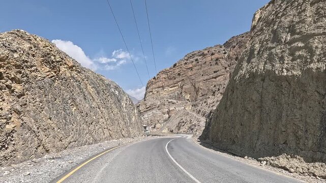 Road hugging mountainside along Kali Gandaki river, sheer cliffs, river corridor Nepal