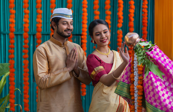 Maharashtrian Couple in traditional dress praying on Gudi Padwa festival