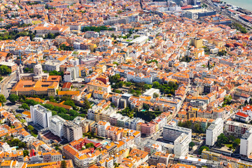 Obraz premium Panoramic aerial view of Lisbon historic city center featuring National Pantheon and traditional orange tile roof residential buildings in Portugal