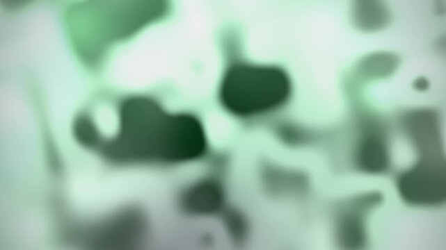 Soft abstract dark green background with glowing amorphous shapes and central light