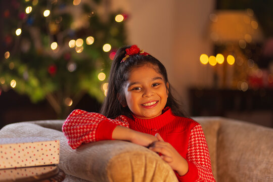 Portrait of a cheerful cute child girl looking at camera