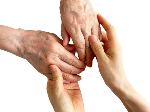 Caregiver holding senior woman's hands in a healthcare support concept
