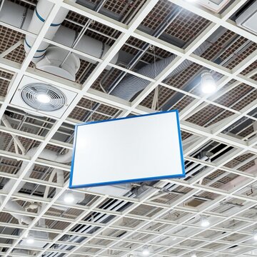 A whiteboard suspended from a ceiling grid in a modern office setting.