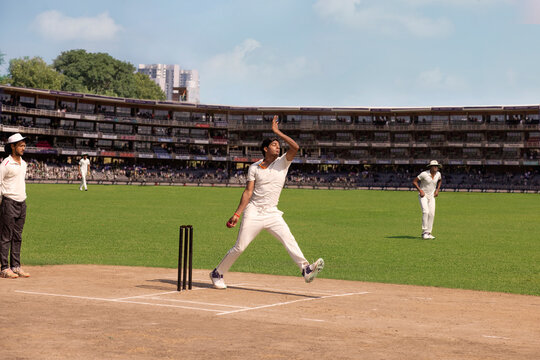 Fast Bowler about to deliver a  ball from the crease, during a cricket match