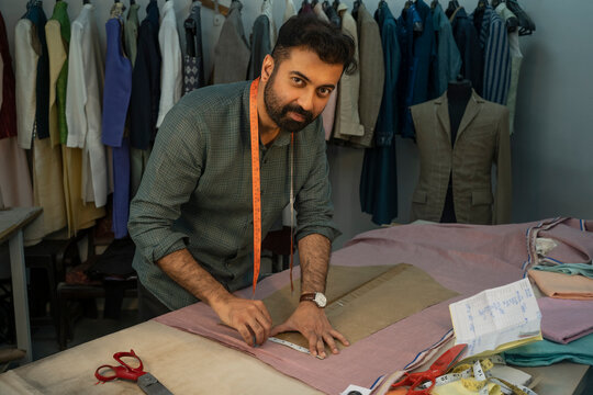 Fashion designer working on menswear clothing in his studio