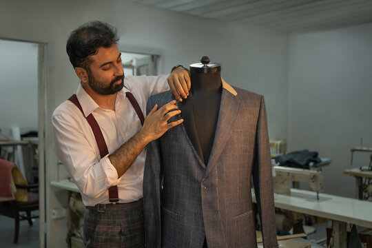 Tailor marking changes on a handmade jacket 