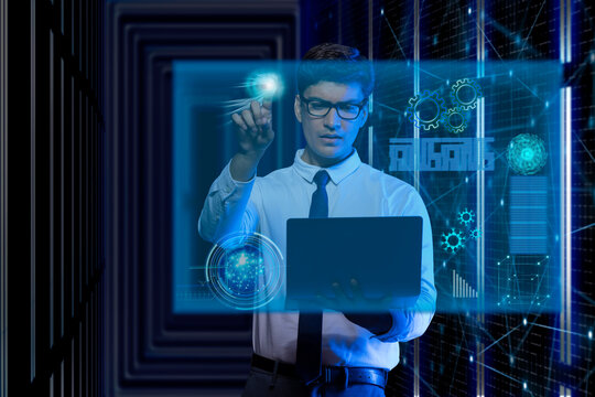 Businessman using laptop touching on virtual screen
