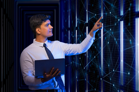 Technician working on the server in the data storage room. 