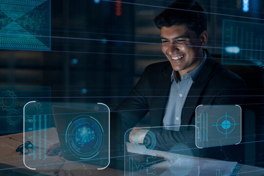 Digitally enhanced shot of a handsome businessman working in the office superimposed over multiple lines of computer code