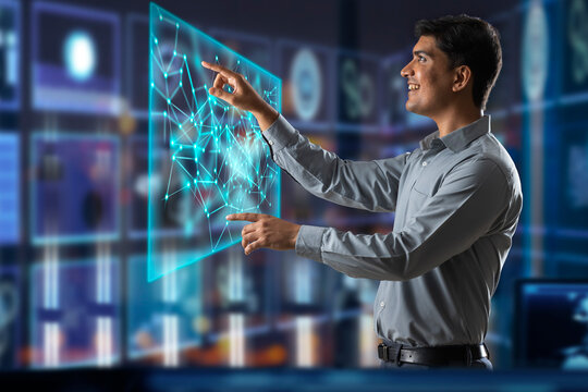 Digitally enhanced shot of a  technician/businessman working with virtual reality projection