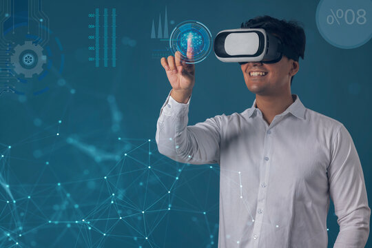  Man wearing VR headset and pointing at digital Screen 