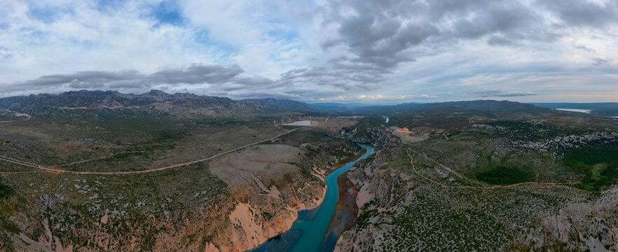 Panoramic aerial view of the Zrmanja River canyon winding through the karst landscape in Croatia