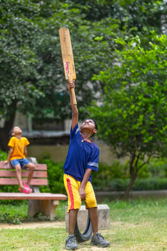 Boy having fun while playing cricket in the park