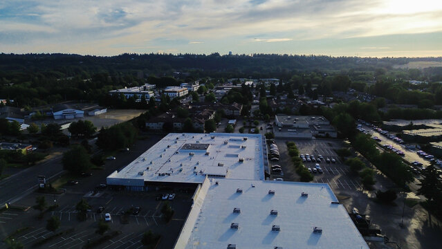 Warehouse facs near Kent Stn feature expansive white reflective roofing systems. These rooftops demonstrate essential urban heat mitigation practices employed throughout industrial zones in WA