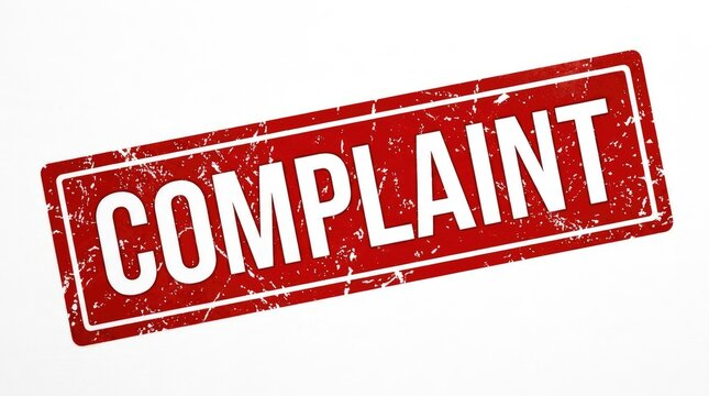 Red complaint stamp on white background. Grunge rubber ink rejection seal for official documents and forms.