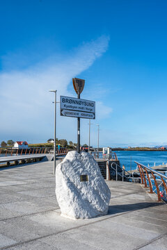 Bronnoysund is a coastal town in Norway located in Scandinavia with a harbor and clear sky visible in the background