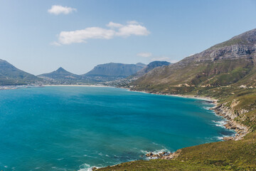 Naklejka premium Hout Bay harbour and Table Mountain from Chapmans Peak