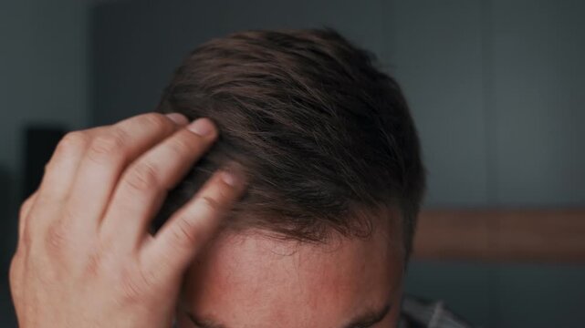 A close-up of a man's healthy hair after 30 years, well-groomed hair and a well-groomed hairstyle. Styled hair with hair powder. Details of the hair on the head.