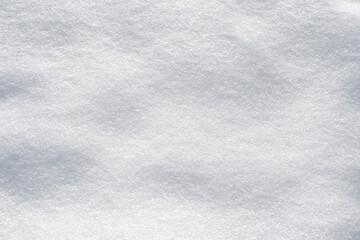 Fototapeta premium Winter snow abstract background, texture of fresh white snow top view,