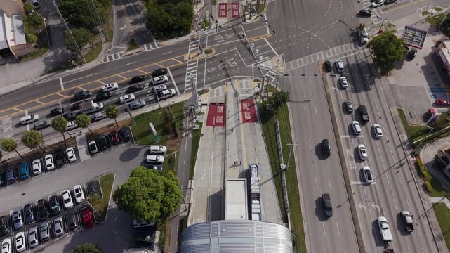 Aerial Top-Down View of Urban Transit Station with Bus Rapid Transit Lanes and City Traffic