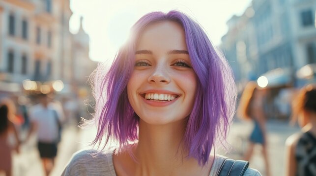 Young woman with vibrant purple hair smiles brightly in a bustling urban street, surrounded by blurred figures, capturing a joyful moment in a lively atmosphere
