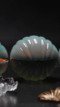 Vertical video: Opening teal shell box hinge moving, revealing copper liner, gold leaf on black top