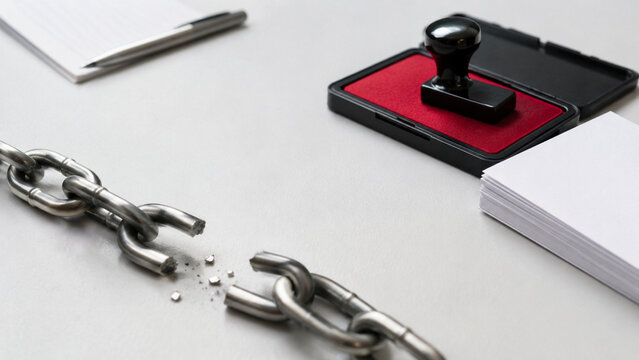 Broken chain on office desk symbolizing stopping corruption