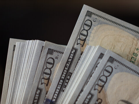 Close-Up of Stacked One Hundred Dollar Bills