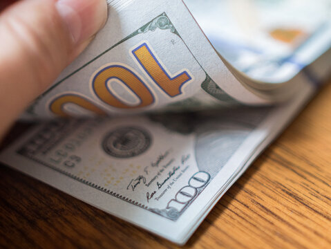 Counting and Organizing Fresh Hundred Dollar Bills