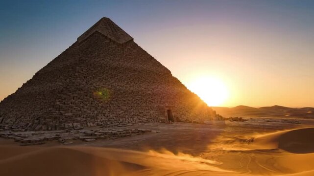 Majestic Egyptian Pyramid in the Desert with Blowing Sand at Sunset