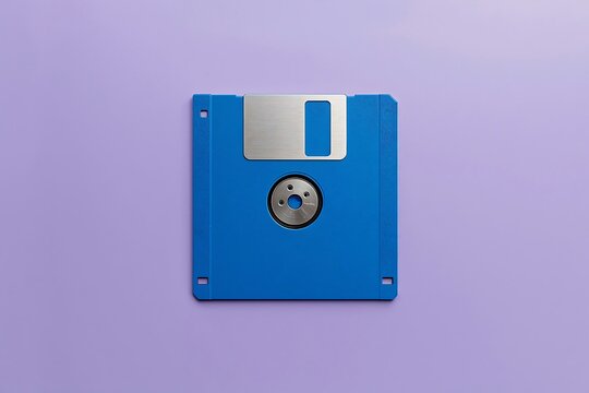 Blue floppy disk on a soft purple background with technology computer magnetic background software hardware electronic information computing obsolete portable diskette innovation platform