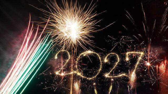 happy new year, new year's eve, silvester, new years eve, sparklers celebration greeting card, new year card - Year 2027 in sparkler font and firework fireworks pyrotechnic, blue night sky background