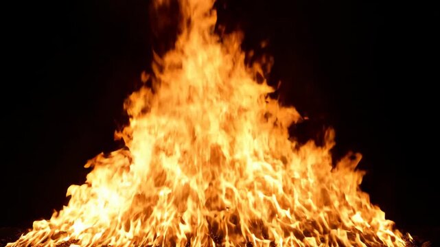 Intense Flames Burning Brightly in Dark Night.