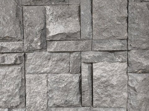 Black andesite natural stone tile arrangement texture with random pattern for exterior wall