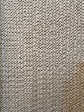 Light gray synthetic plastic woven texture with regular crisscross pattern for furniture or bag material.