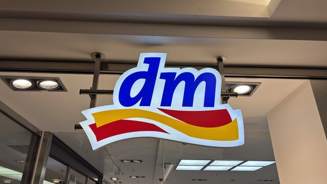 M&uuml;lheim an der Ruhr, Germany - July 11, 2026: Logo of dm pharmacy chain at a branch storefront
