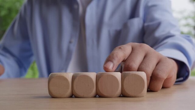 Human finger selecting wooden cube with emotion face icon changing from neutral to happy among angry and smiling characters, emotional transformation, positive mindset, employee engagement concept