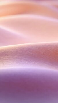 Vertical video: Gliding silk fabric shifting with soft light moving in closeup, revealing ridge