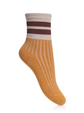 Mustard knitted ribbed sock with beige cuff and brown stripes on mannequin foot isolated on white background side view