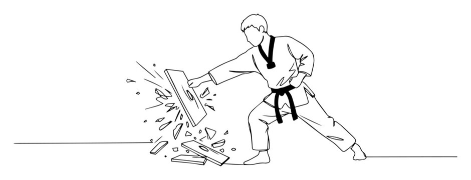 karateka breaking board with powerful strike