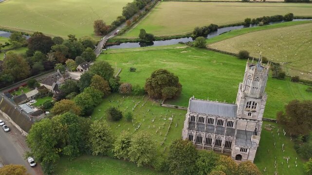 Aerial View of Fotheringhay Medieval Church and River Nene Winding Through English Northamptonshire