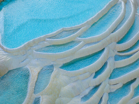 Bai Shui Tai terraced travertine pools with vivid blue water in Yunnan China