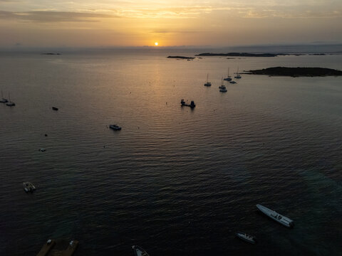 Piantarella bay sunset with anchored boats in Corsica