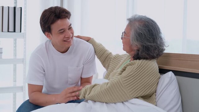 Generational Bonds: A young man offers comfort and support to a senior woman, sharing a tender moment of connection and reassurance. Their interaction is marked by mutual respect, love.