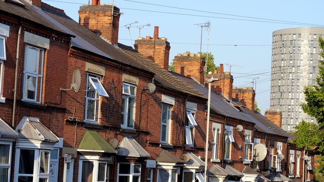British terraced houses with brick facades, traditional row housing street in England, UK real estate property